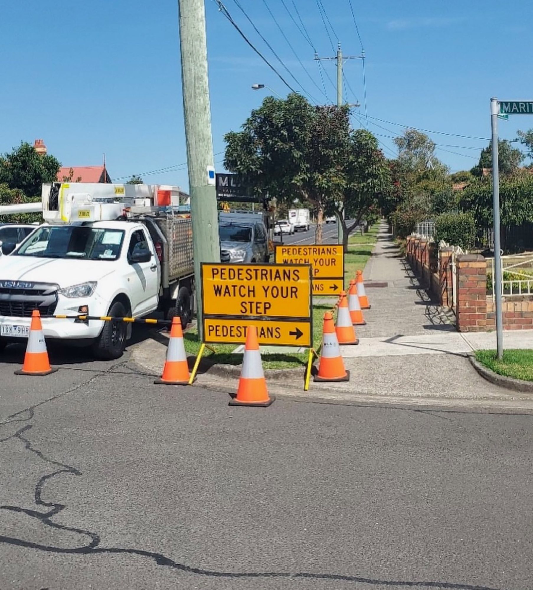 Pedestrian signage on a residential corner in Melbourne