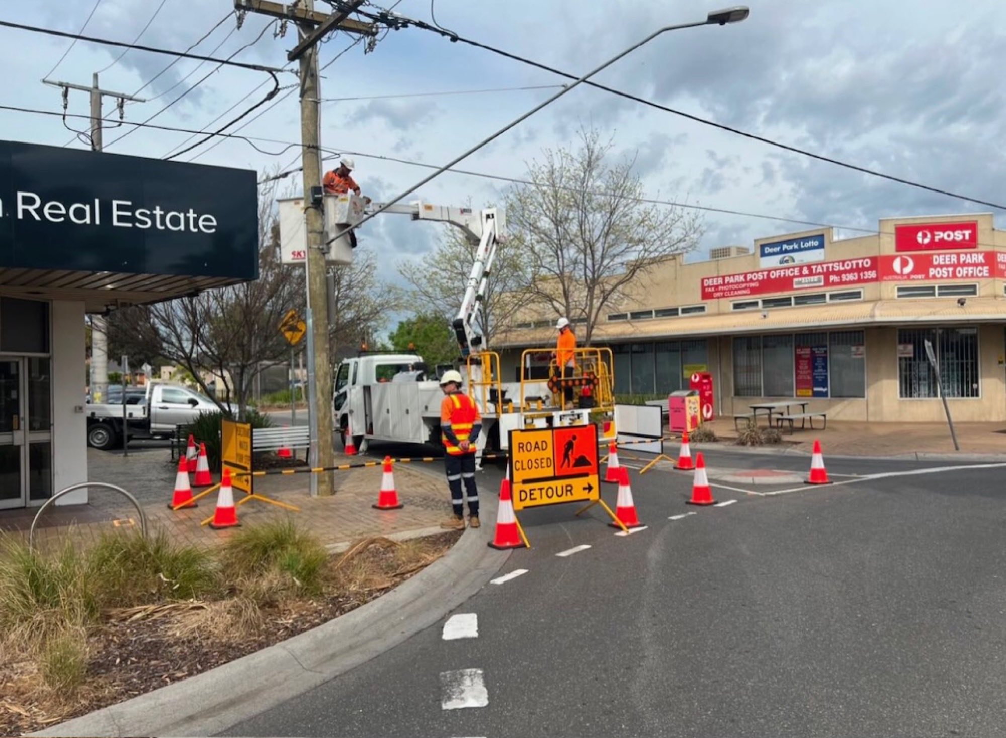 MLA Traffic working on a busy Melbourne urban street with cherry picker and signage