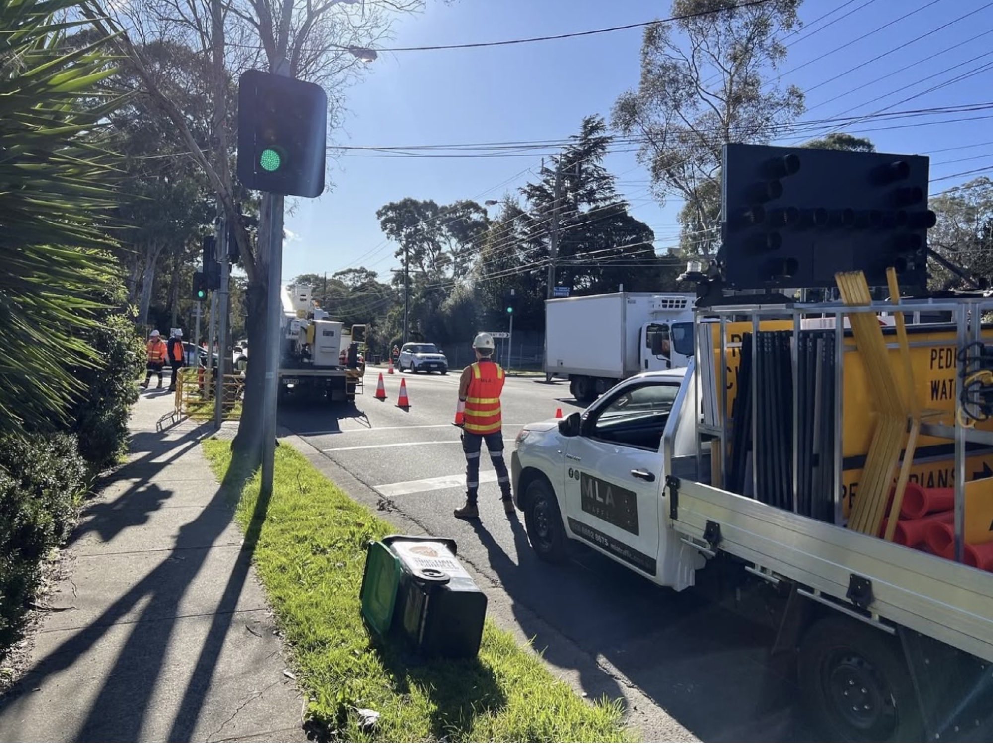MLA Traffic controller and branded ute managing an arterial road in Melbourne